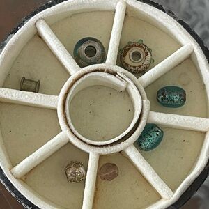 Seven bracelet beads that have been lying in my jewelry box.